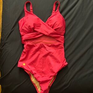 Bright pink swimwear, one piece. Mesh/ see thru midriff area. Size L. Worn 1x.